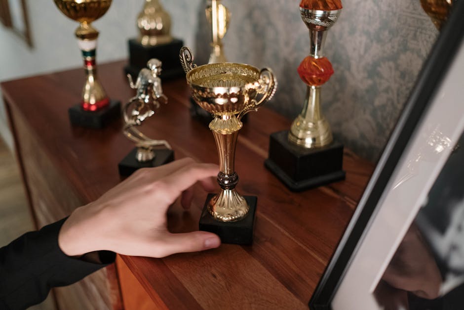 Achievement system with badges, trophies and rewards for players